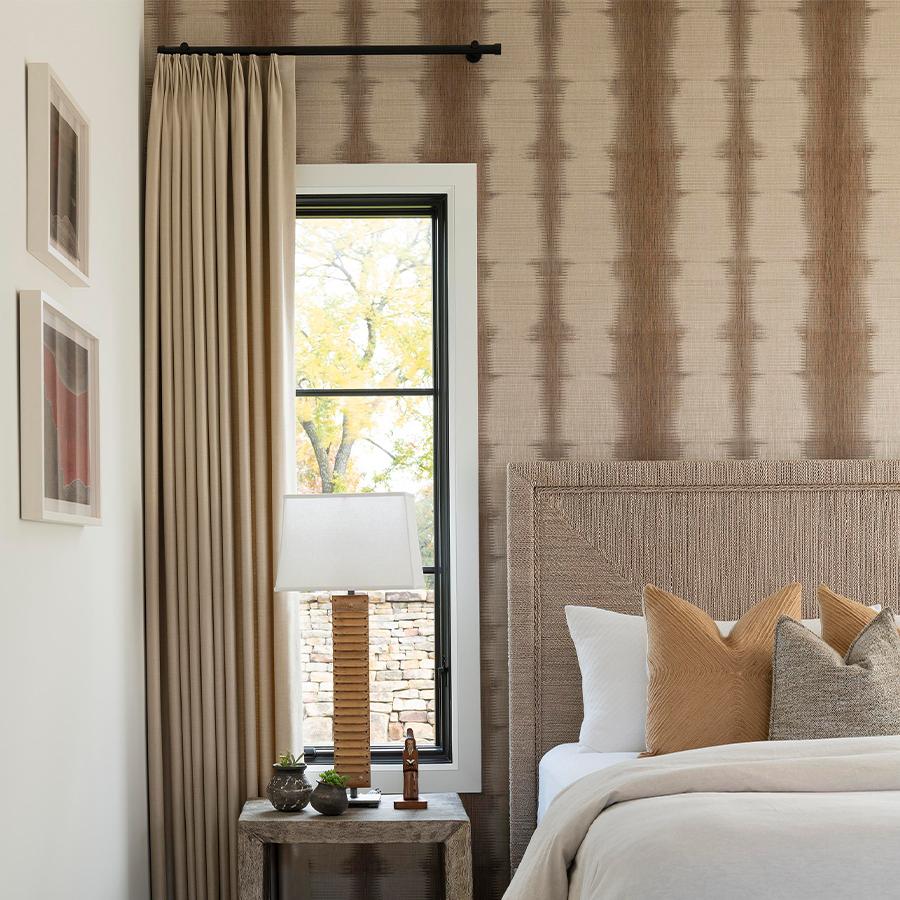 Reminiscent of sound waves and tie-dye, Frequency feels soft to the touch and adds a unique touch to this bedroom.