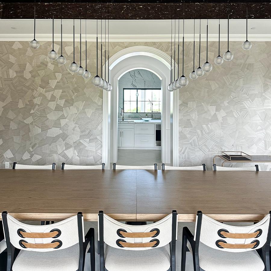 Geometric wood veneers, hand-cut and artfully assembled, form the unique patterns of Origami. This wallcovering add texture and dimension to this beautiful dining room.